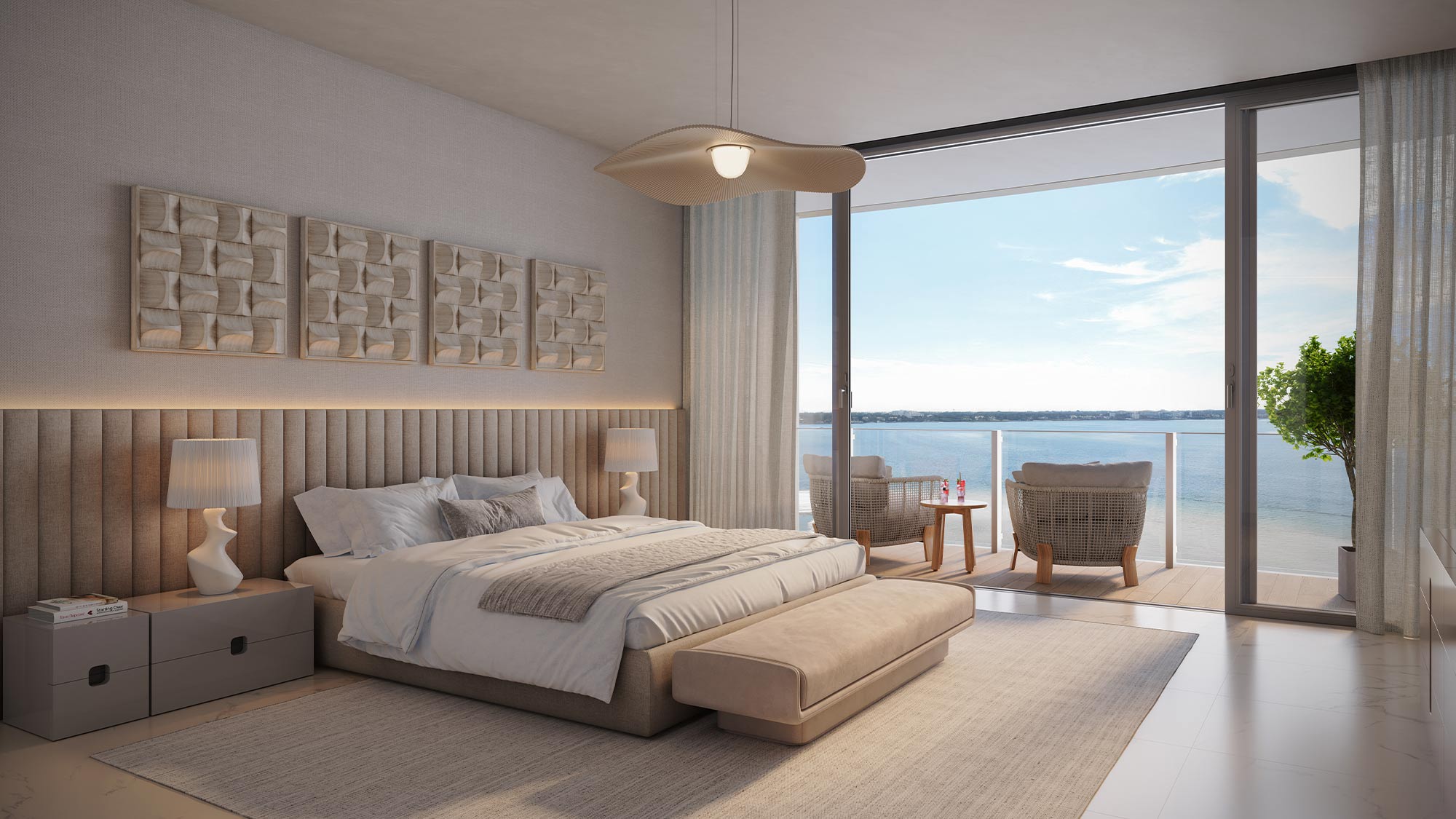 Bright modern bedroom with large bed, cushioned headboard, textured art, ocean view balcony, glass doors, pendant light